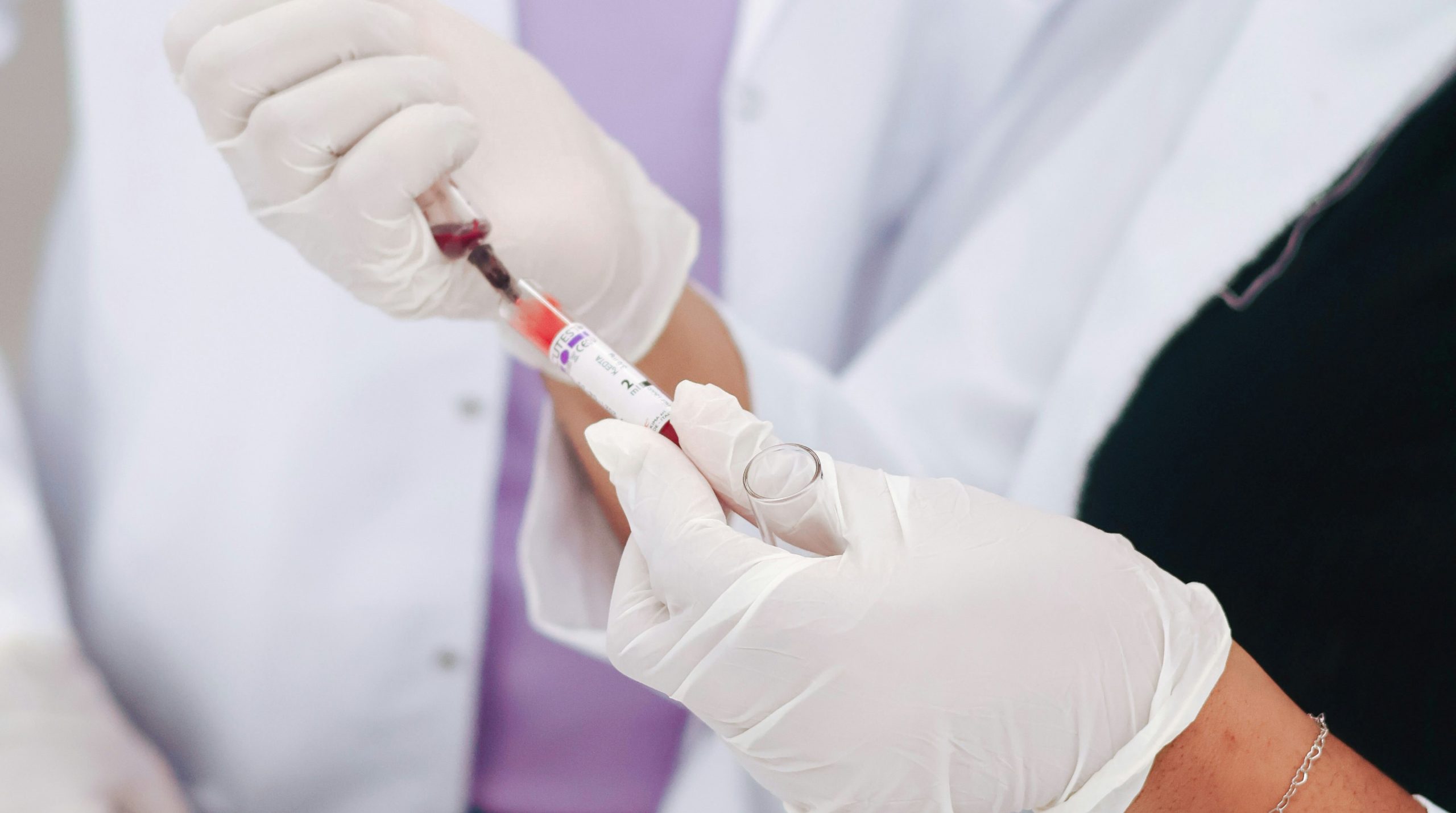 Technician with syringe